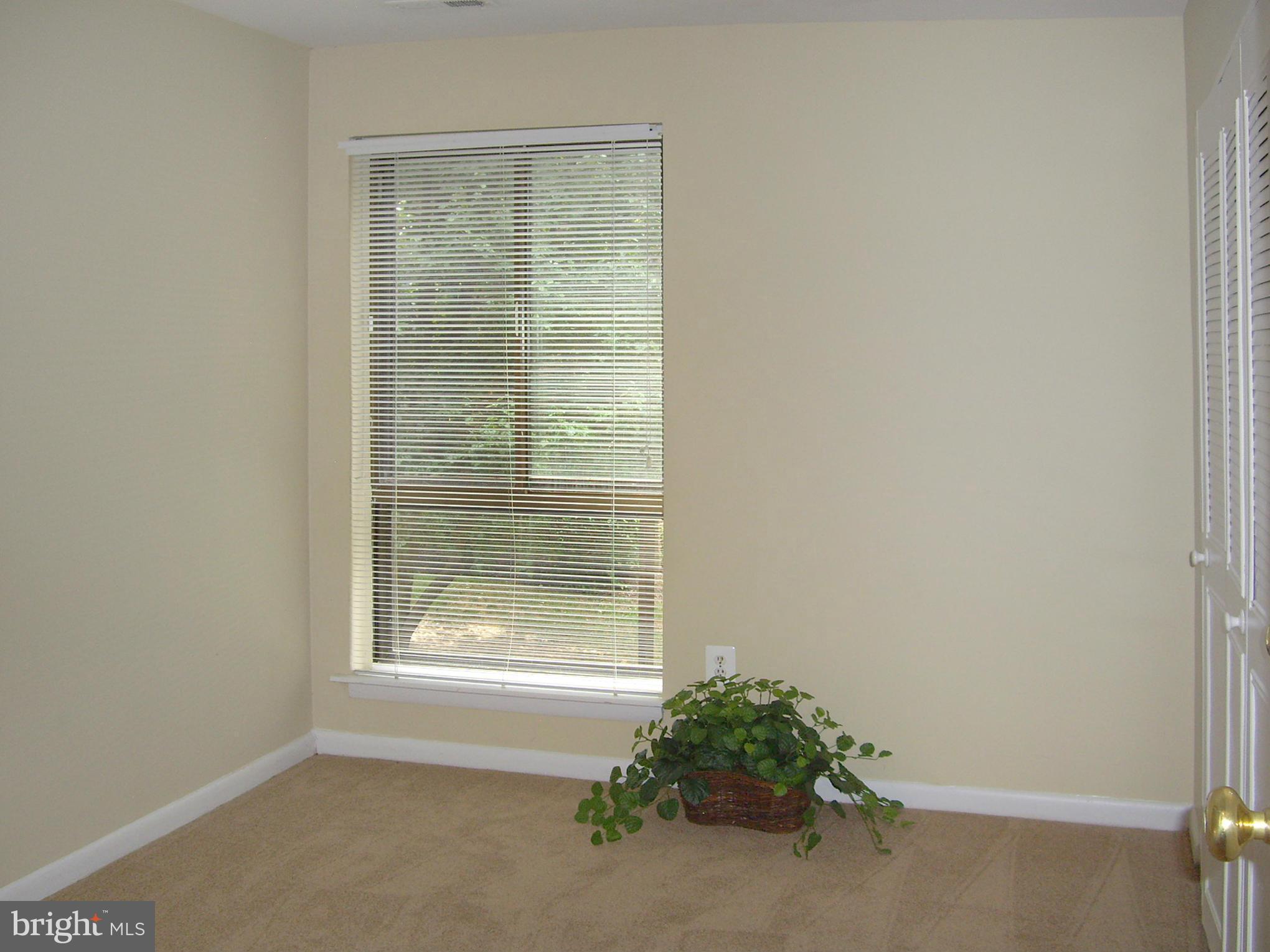 11212 Chestnut Grove Square, Unit 114 Reston, VA 20190 - Photo 16 of 18 a room that has a window in it