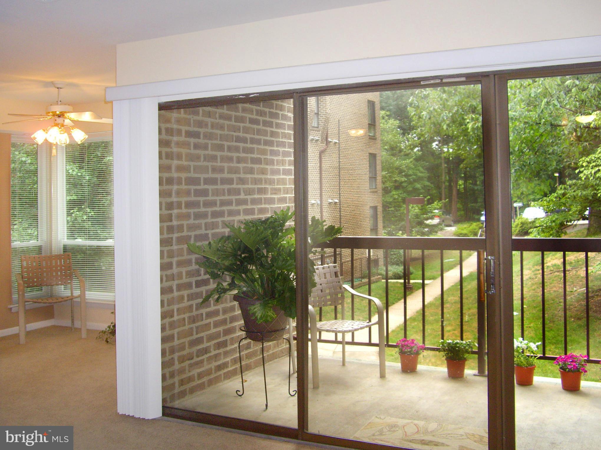 11212 Chestnut Grove Square, Unit 114 Reston, VA 20190 - Photo 5 of 18 a view of staircase with a floor to ceiling window and a room