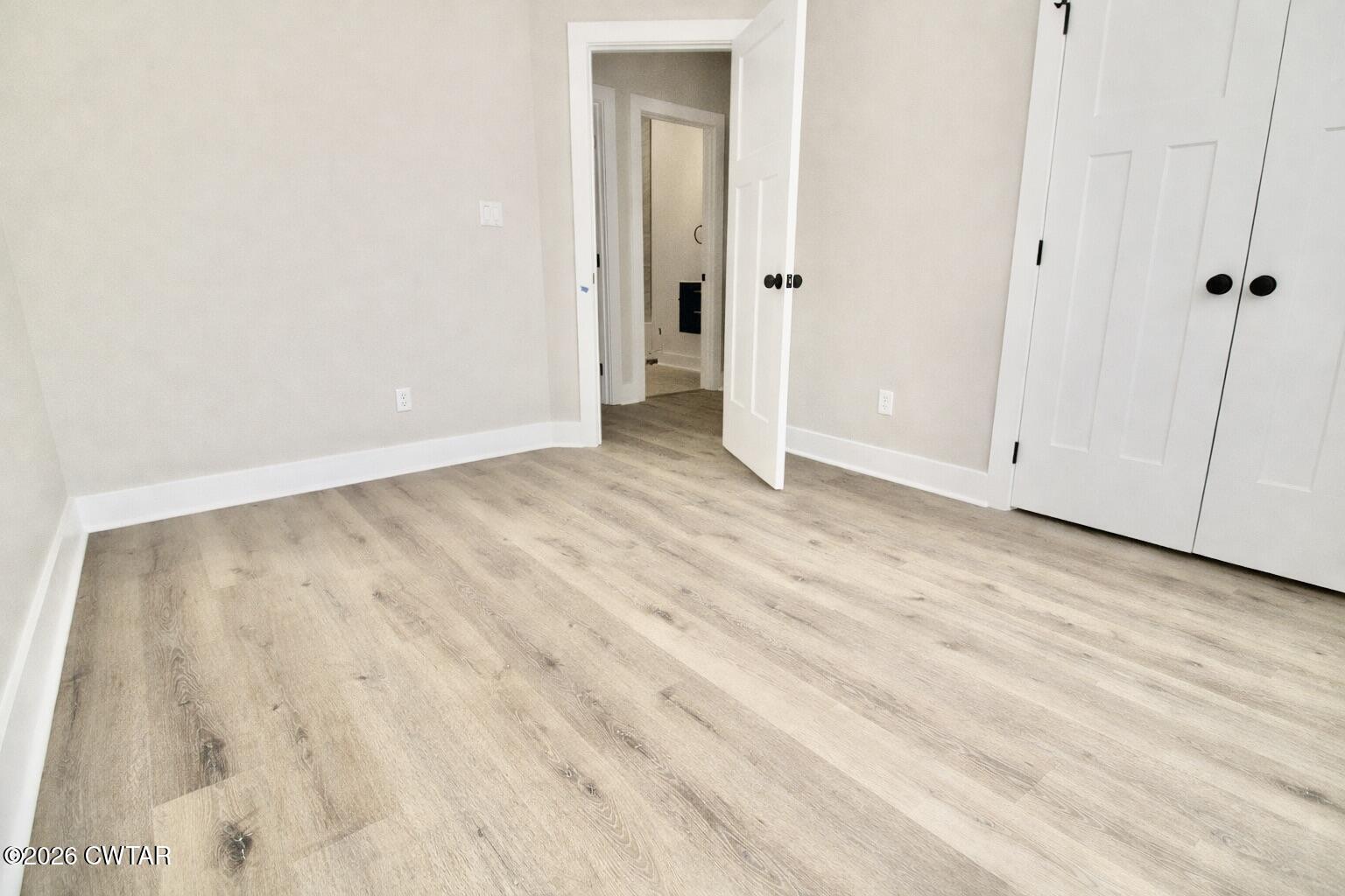 25 Weatherstone Drive Jackson, TN 38305 - Photo 11 of 15 a view of an empty room with wooden floor