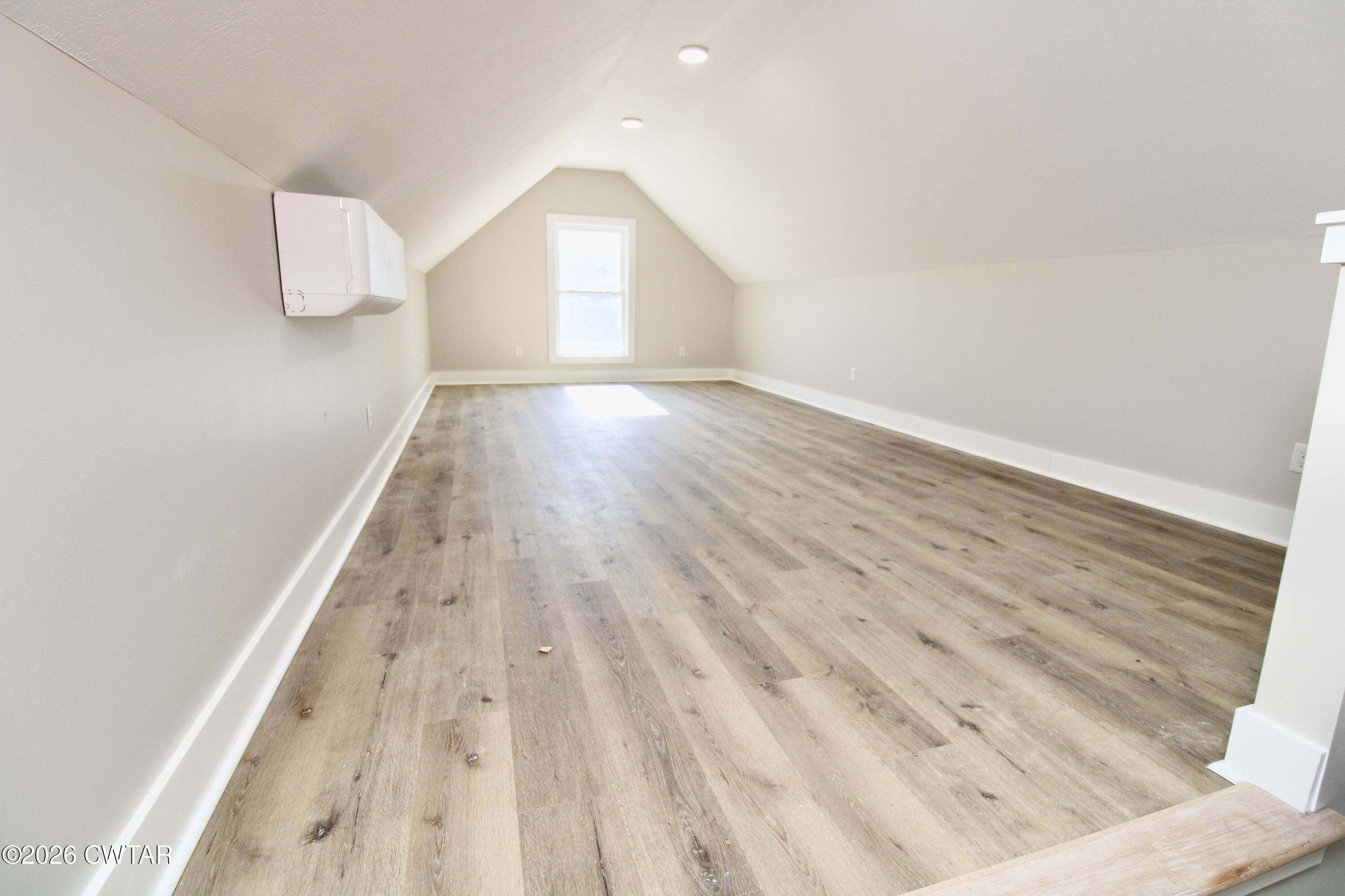 25 Weatherstone Drive Jackson, TN 38305 - Photo 12 of 15 a view of an empty room and wooden floor