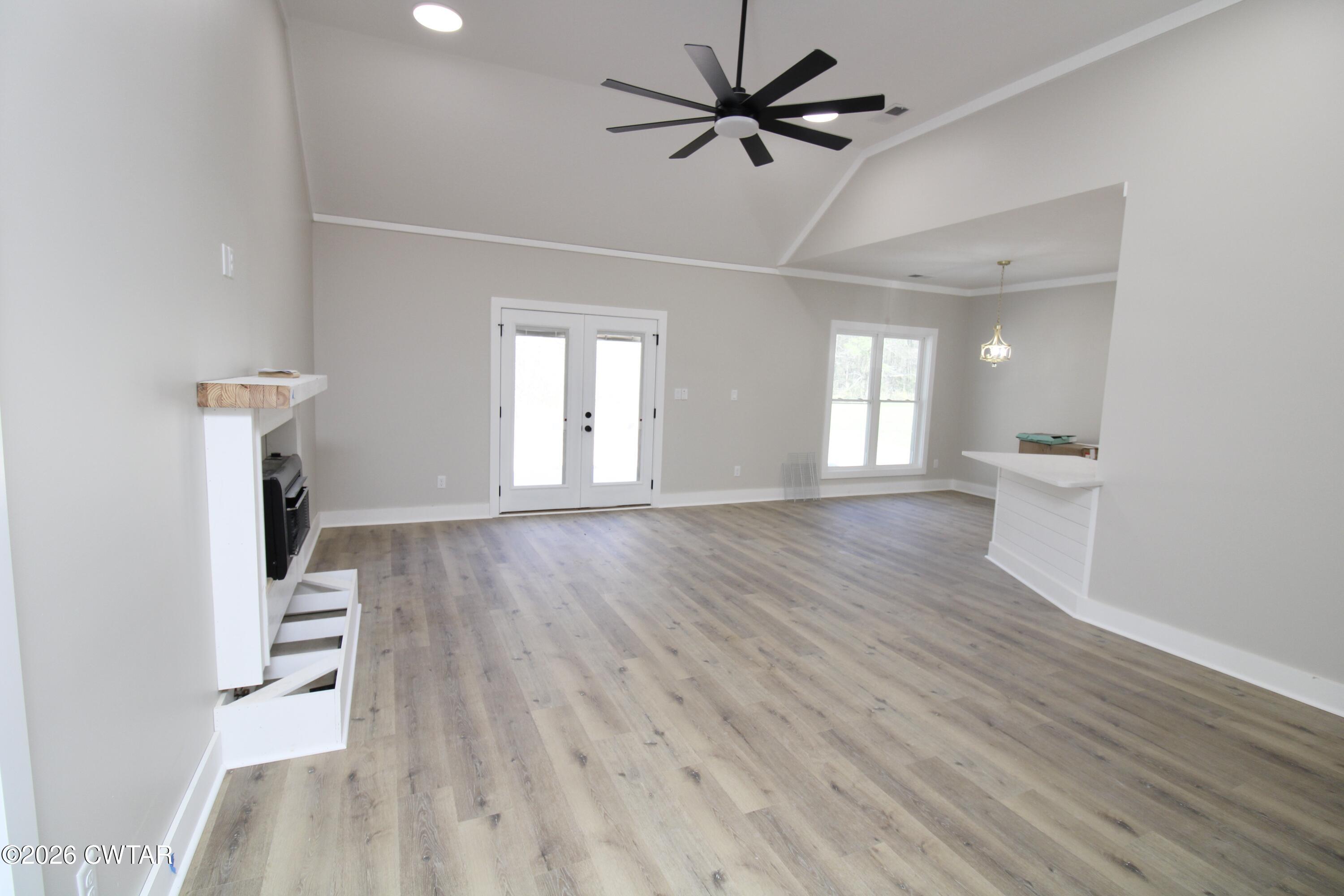 25 Weatherstone Drive Jackson, TN 38305 - Photo 5 of 15 a view of an empty room with a window and wooden floor