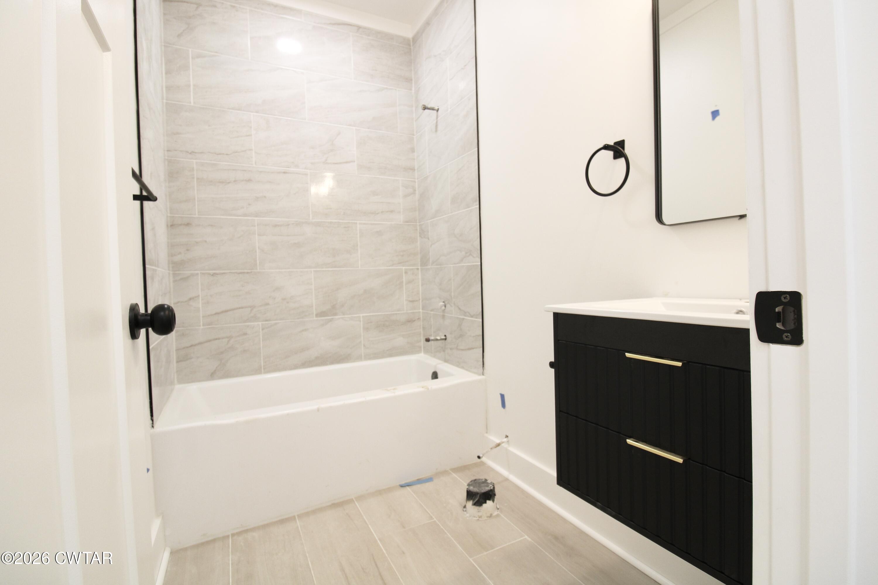 25 Weatherstone Drive Jackson, TN 38305 - Photo 9 of 15 a bathroom with a bathtub and a shower