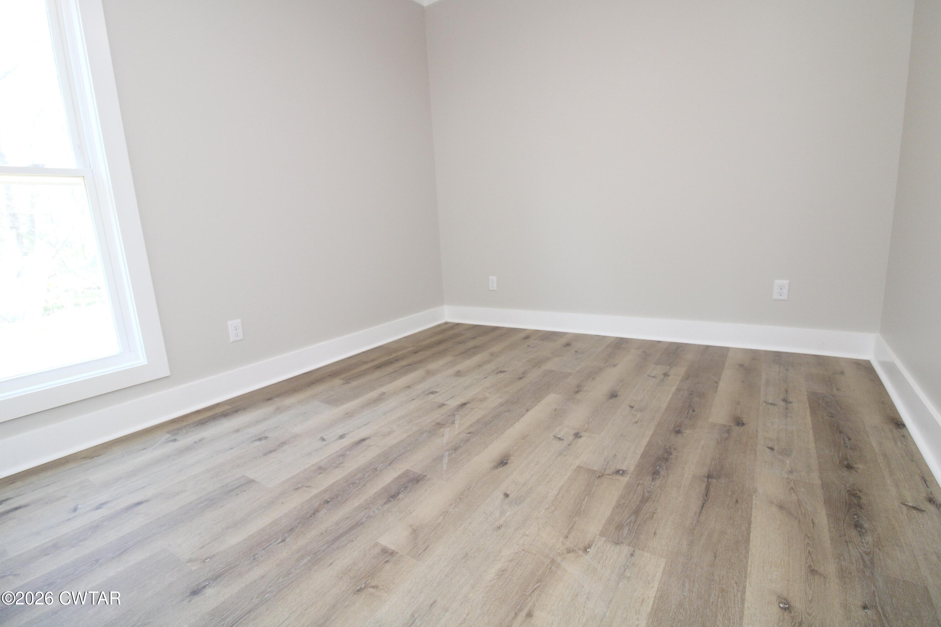 25 Weatherstone Drive Jackson, TN 38305 - Photo 10 of 15 a view of wooden floor in a room