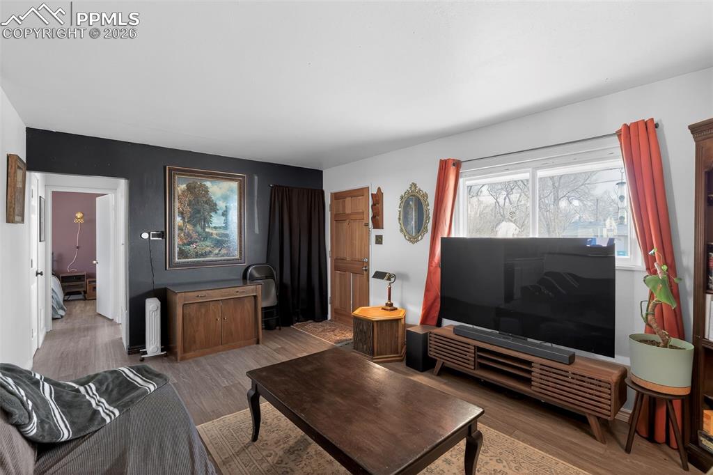 702 Erie Road Colorado Springs, CO 80910 - Photo 13 of 15 Living area featuring wood finished floors