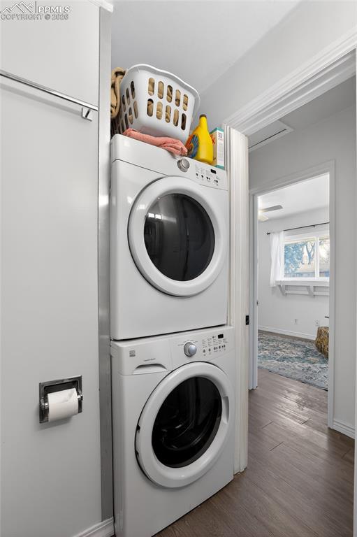 702 Erie Road Colorado Springs, CO 80910 - Photo 15 of 15 Laundry area featuring wood finished floors and stacked washer and clothes dryer