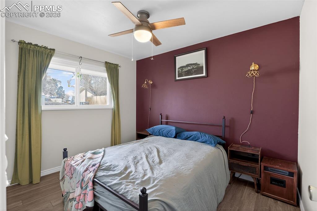 702 Erie Road Colorado Springs, CO 80910 - Photo 5 of 15 Bedroom with wood finished floors and ceiling fan