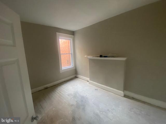 2730 Riggs Avenue Baltimore, MD 21216 - Photo 2 of 9 an empty room with windows
