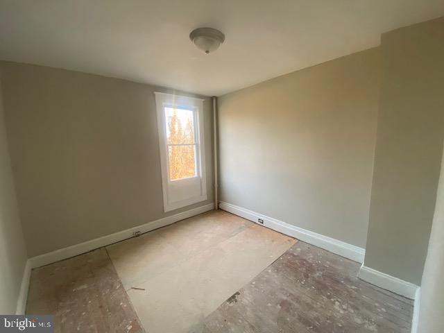 2730 Riggs Avenue Baltimore, MD 21216 - Photo 6 of 9 an empty room with windows