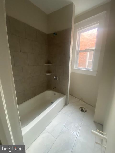 2730 Riggs Avenue Baltimore, MD 21216 - Photo 7 of 9 a bath room with a bath tub and a shower