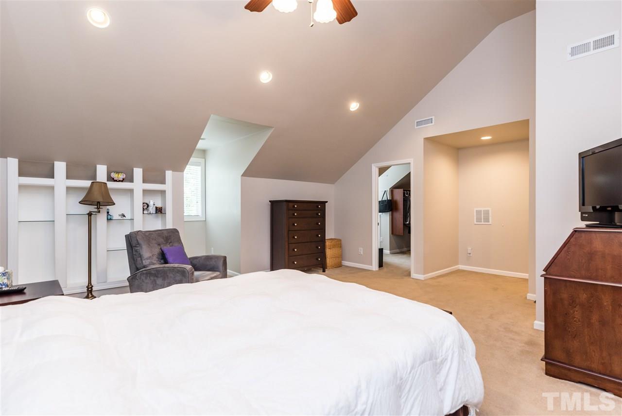 2808 Oberry Street Raleigh, NC 27607 - Photo 11 of 24 a large bedroom with a bed and a television