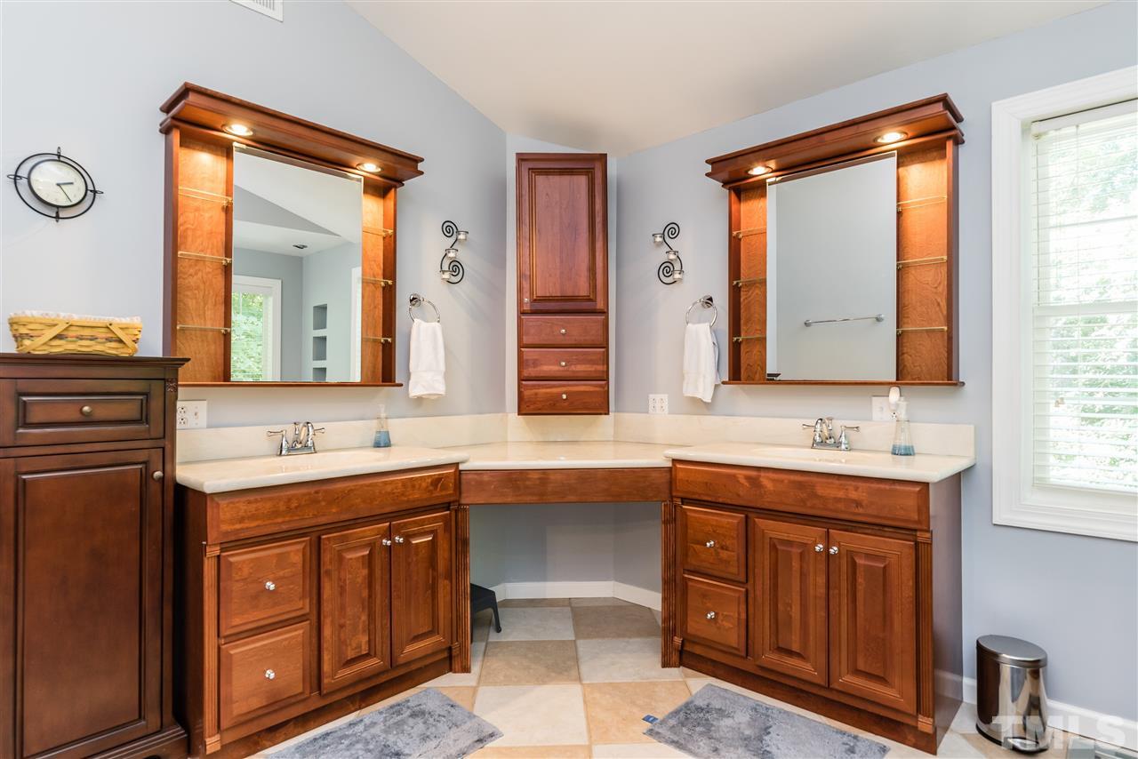 2808 Oberry Street Raleigh, NC 27607 - Photo 12 of 24 a bathroom with a sink vanity and mirror