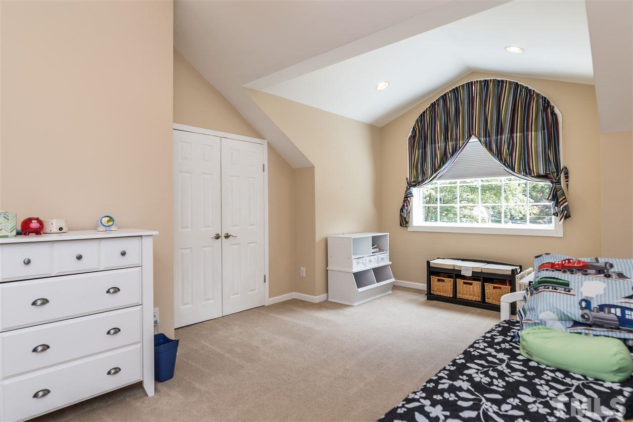 2808 Oberry Street Raleigh, NC 27607 - Photo 14 of 24 a bedroom with furniture and a window