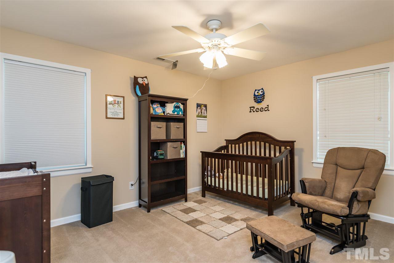 2808 Oberry Street Raleigh, NC 27607 - Photo 15 of 24 a bedroom with furniture and a window