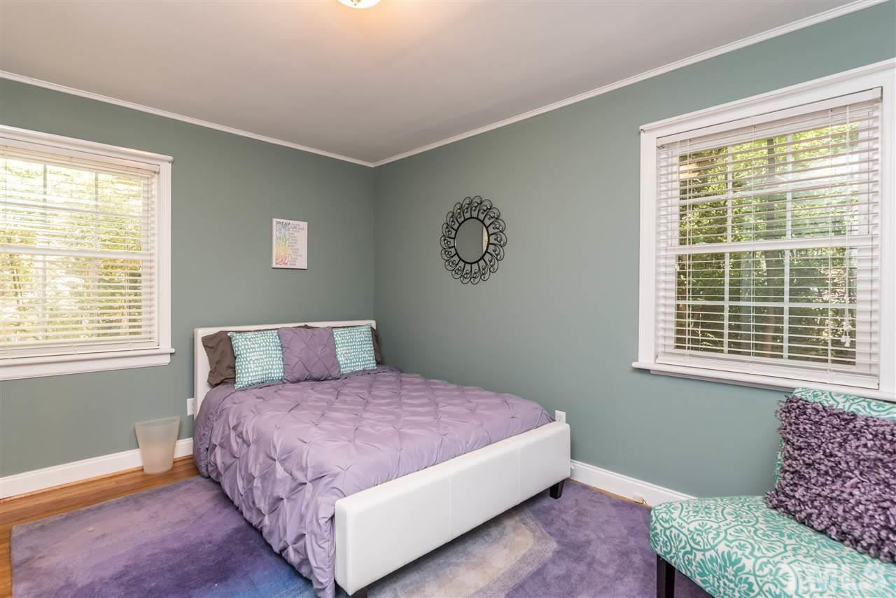 2808 Oberry Street Raleigh, NC 27607 - Photo 17 of 24 a bedroom with a large bed and a window