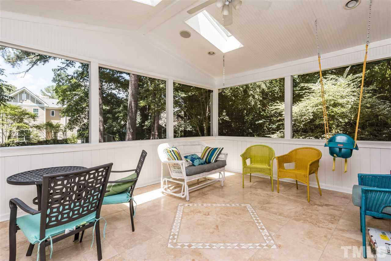 2808 Oberry Street Raleigh, NC 27607 - Photo 18 of 24 a view of a dining table and chairs in the patio