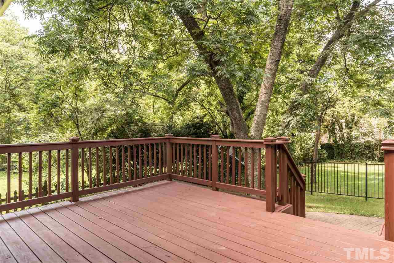 2808 Oberry Street Raleigh, NC 27607 - Photo 19 of 24 a balcony with wooden floor and trees