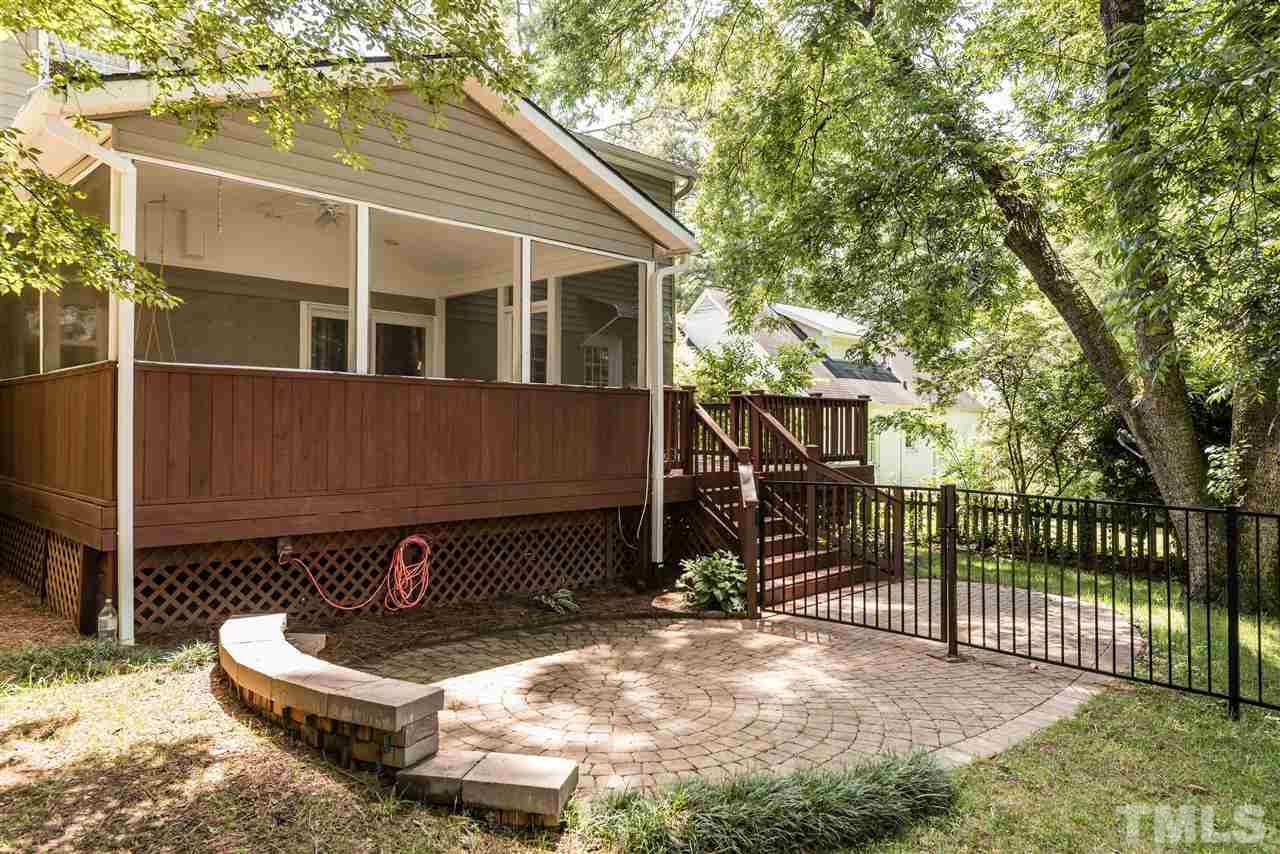 2808 Oberry Street Raleigh, NC 27607 - Photo 20 of 24 a backyard of a house with basket ball court and wooden fence