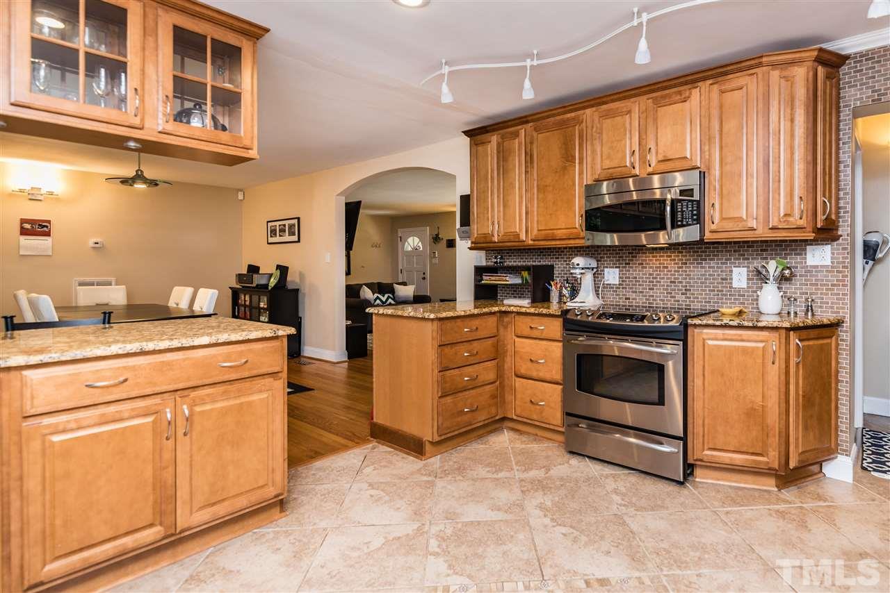 2808 Oberry Street Raleigh, NC 27607 - Photo 7 of 24 a kitchen with cabinets appliances and a window