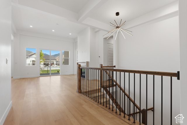 538 North Legend Circle, Unit 505 Mapleton, UT 84664 - Photo 12 of 48 Hardwood flooring, contemporary chandelier, sliding glass doors, coffered ceiling, and wrought iron balusters
