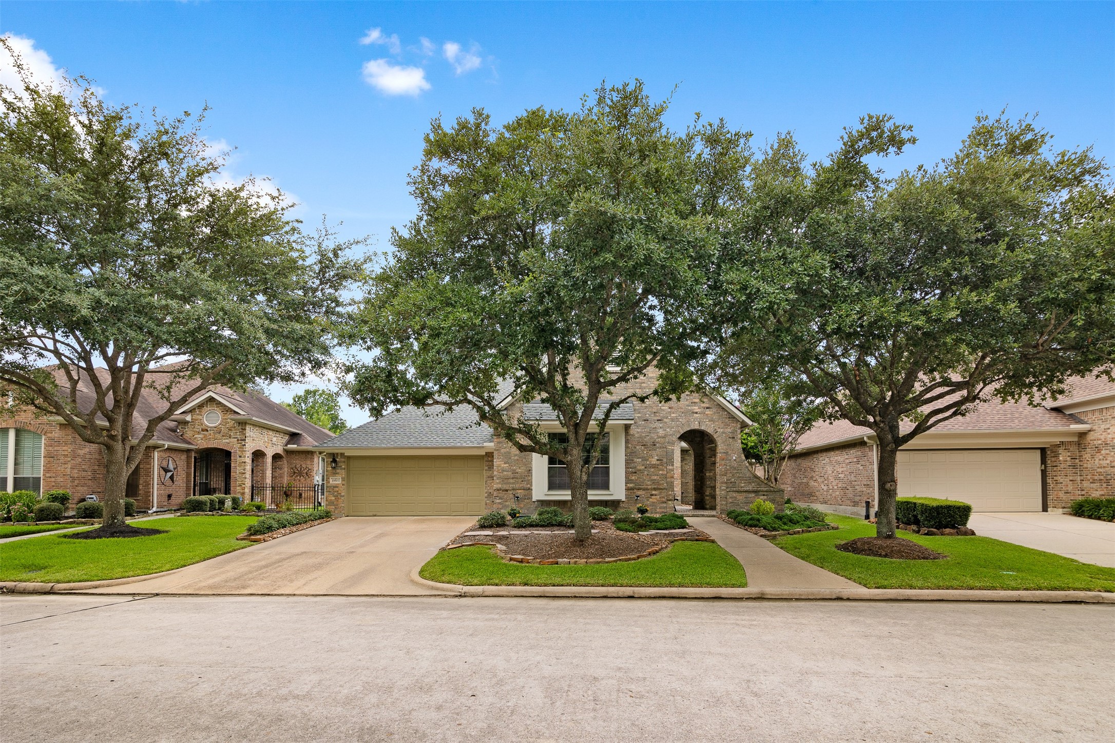 19507 Remington Manor Street Spring, TX 77379 - Photo 1 of 33 Desirable one-story home in Gleannloch Farms featuring professional landscaping and mature trees.