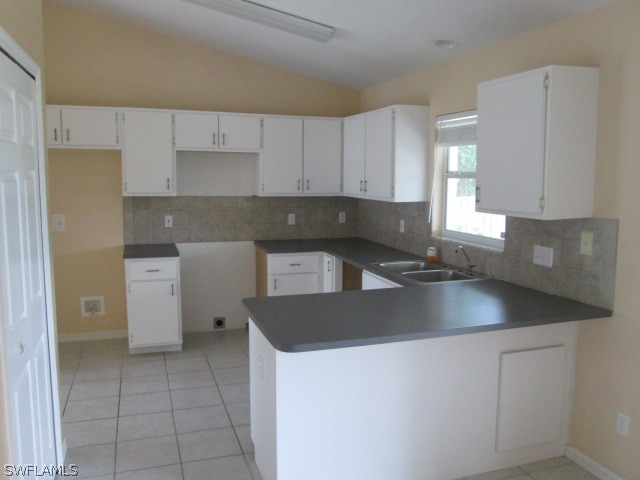 18359 Heather Road Fort Myers, FL 33967 - Photo 4 of 10 a kitchen with a sink a stove and cabinets