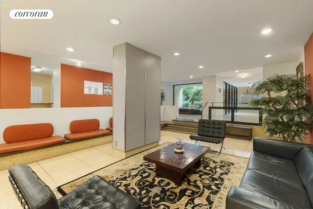 a living room with furniture and a rug