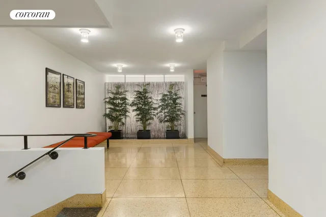 a view of a hallway with windows