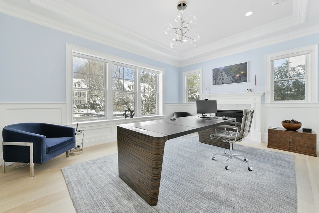32 Burroughs Road Lexington, MA 02420 - Photo 14 of 38 a living room with furniture a table and a fireplace