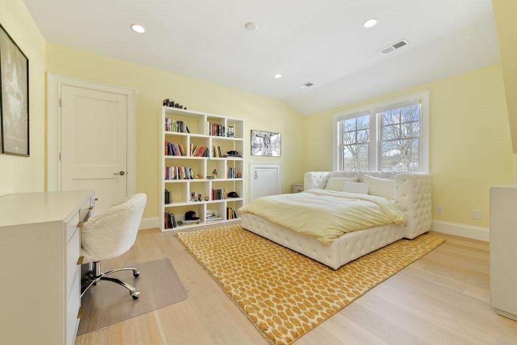 32 Burroughs Road Lexington, MA 02420 - Photo 26 of 38 a bedroom with a bed and a table