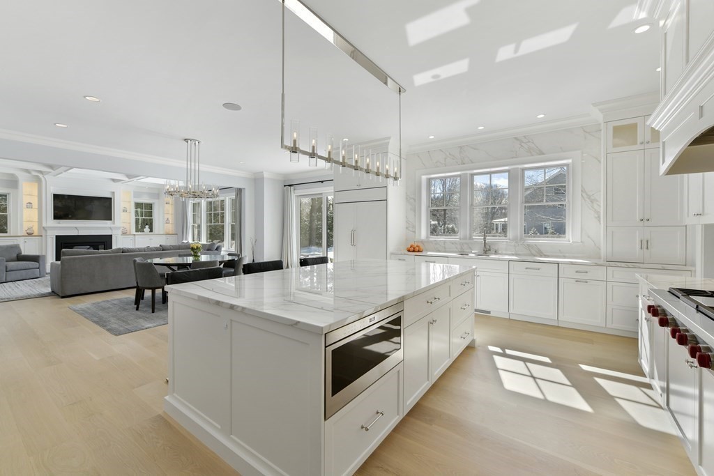 32 Burroughs Road Lexington, MA 02420 - Photo 4 of 38 a large white kitchen with a stove and a sink