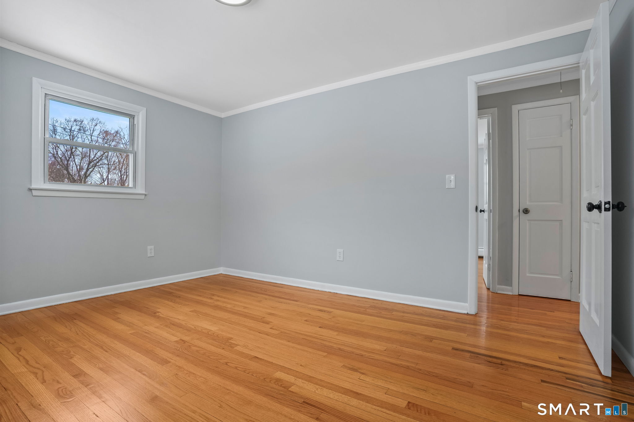 25 Fairchild Road Stratford, CT 06614 - Photo 15 of 40 a view of an empty room with wooden floor