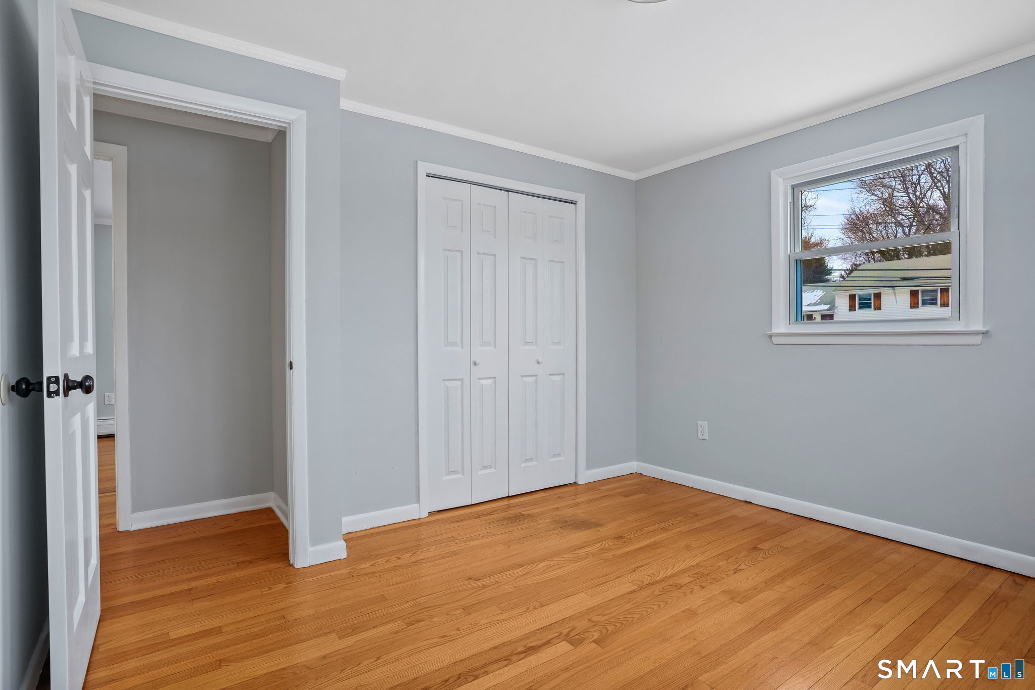 25 Fairchild Road Stratford, CT 06614 - Photo 21 of 40 a view of an empty room with wooden floor and a window