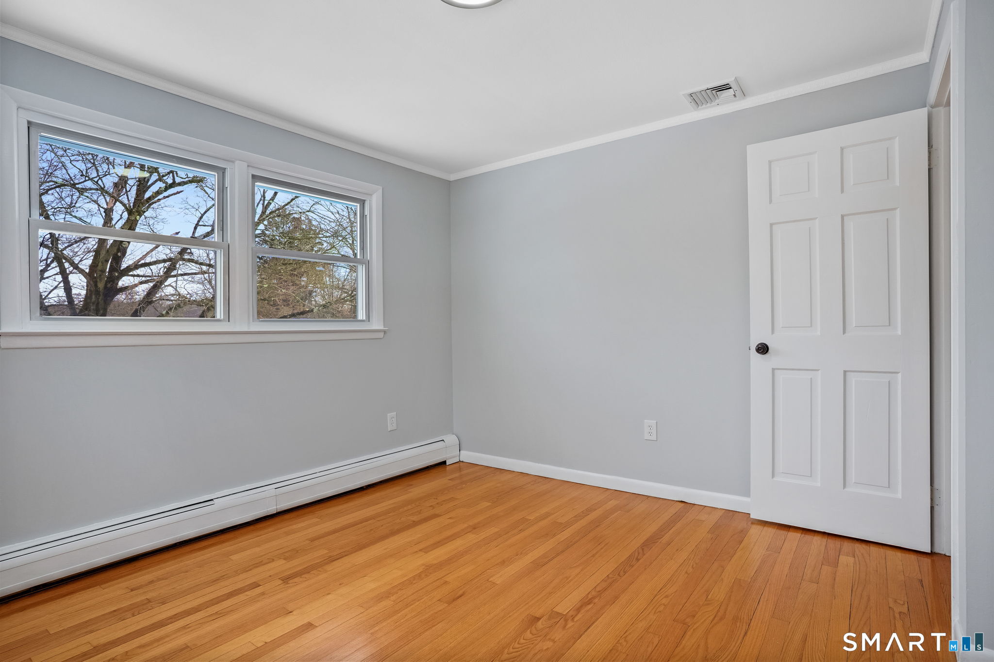 25 Fairchild Road Stratford, CT 06614 - Photo 22 of 40 a view of a room with wooden floor and window