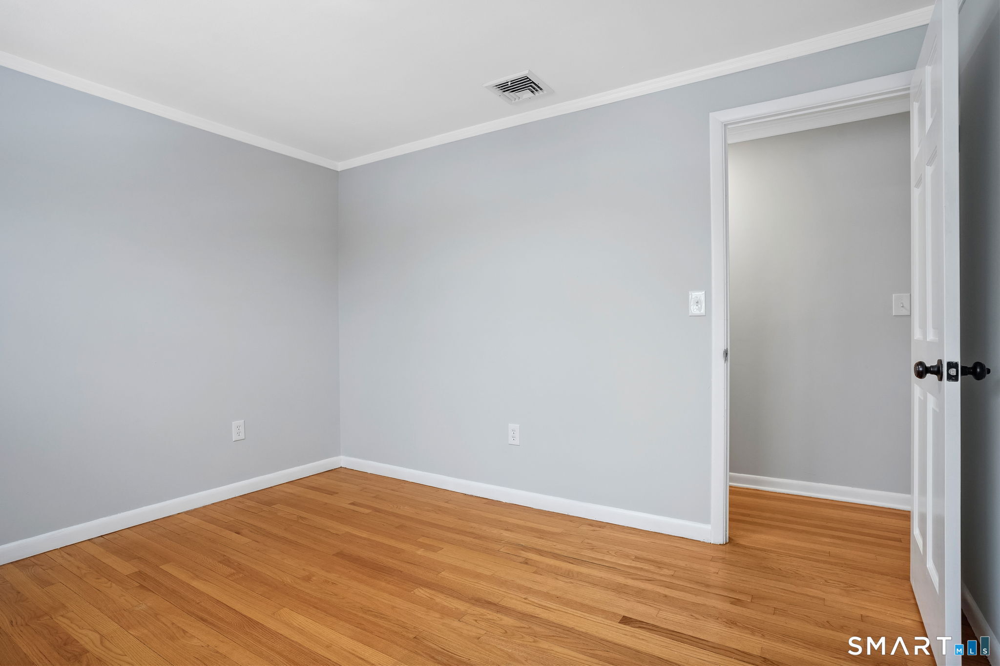25 Fairchild Road Stratford, CT 06614 - Photo 26 of 40 a view of empty room with wooden floor