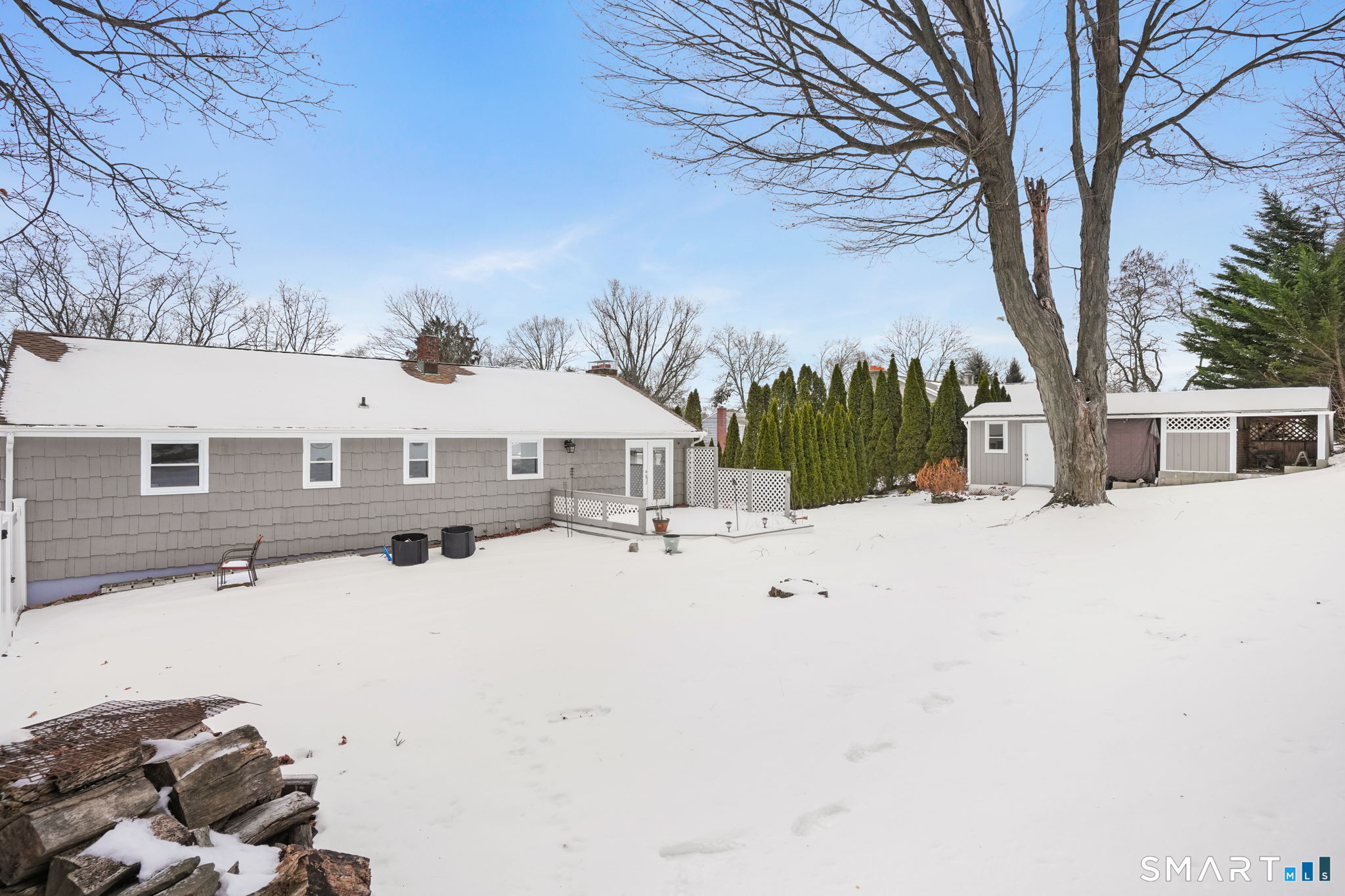 25 Fairchild Road Stratford, CT 06614 - Photo 36 of 40 a front view of a house with a yard covered in snow