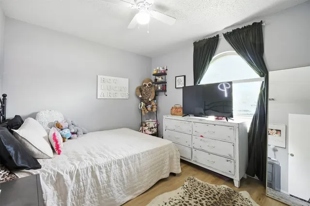 a bathroom with a toilet a sink and a mirror