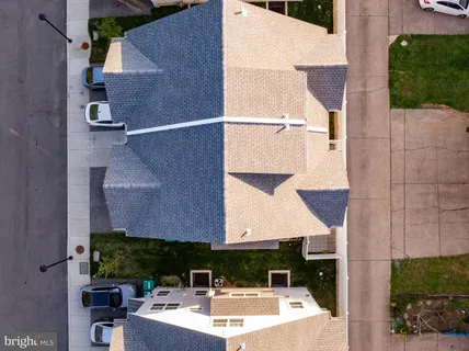 an aerial view of house with a yard