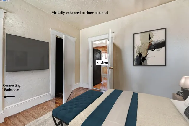 a bedroom with bed and wooden floor