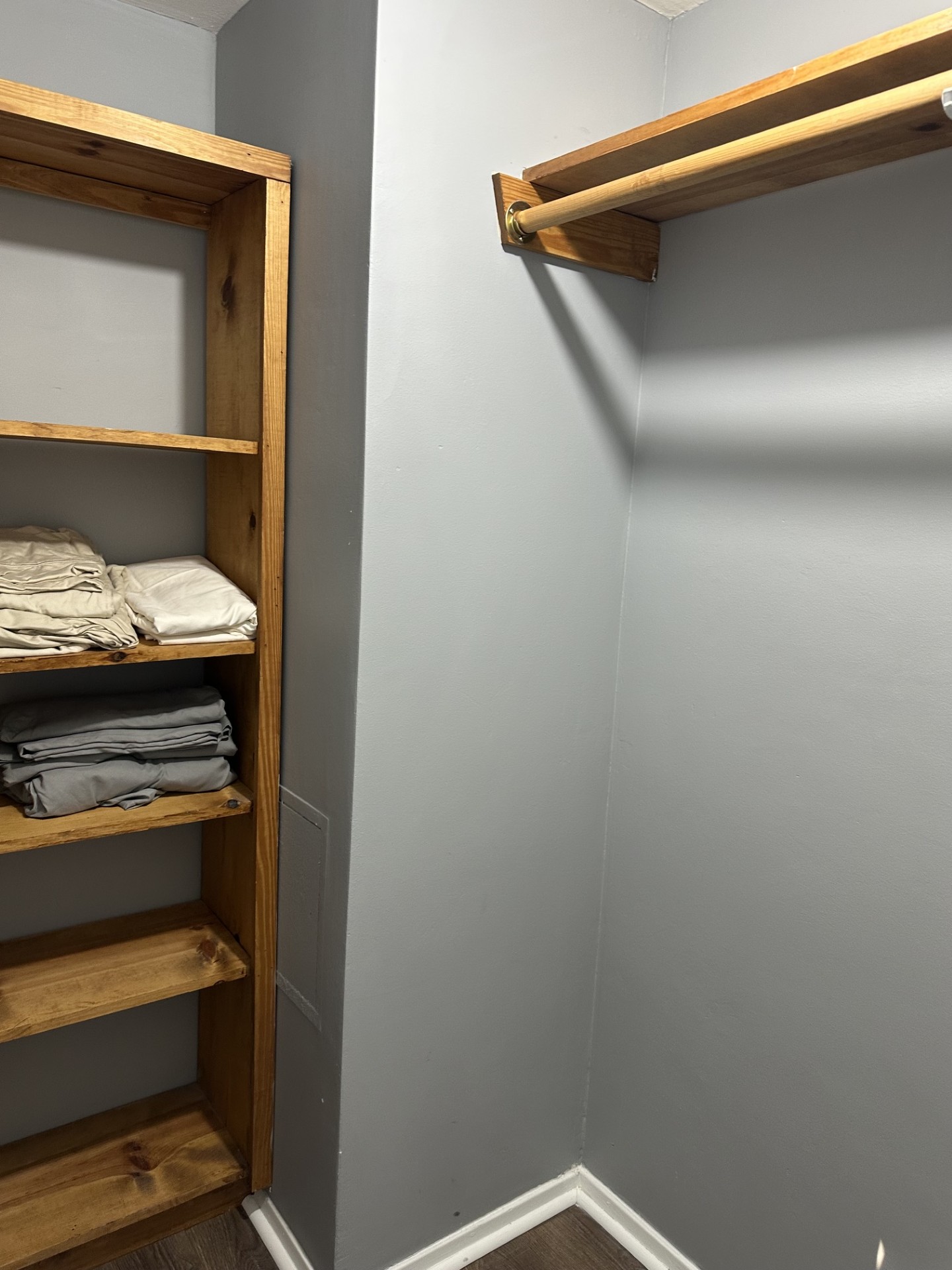 2215 Post Road, Unit 2044 Austin, TX 78704 - Photo 23 of 34 Custom wooden shelving and a sturdy hanging rod maximize storage potential in this closet.