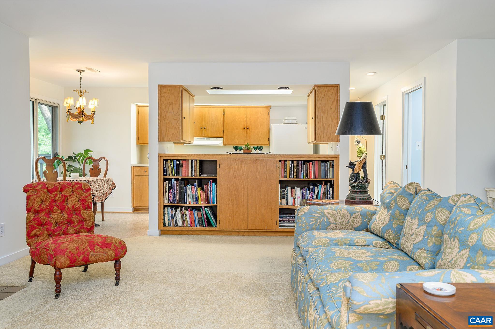 207 2nd Street Northwest, Unit D Charlottesville, VA 22902 - Photo 7 of 18 a living room with furniture and a large window