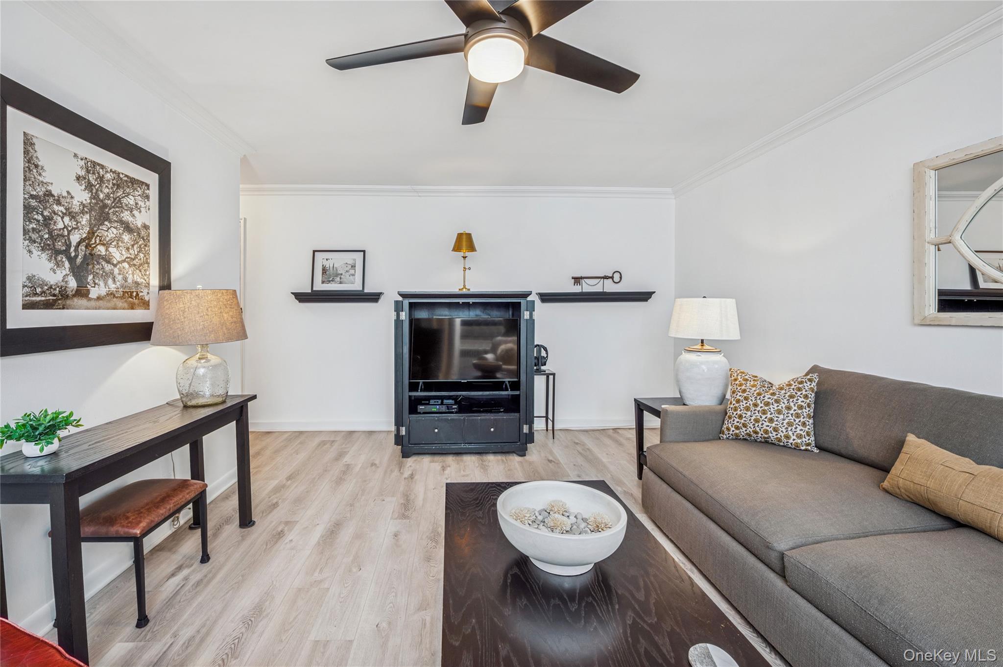 781 Palmer Road, Unit 4F Bronxville, NY 10708 - Photo 3 of 18 a living room with furniture and a flat screen tv