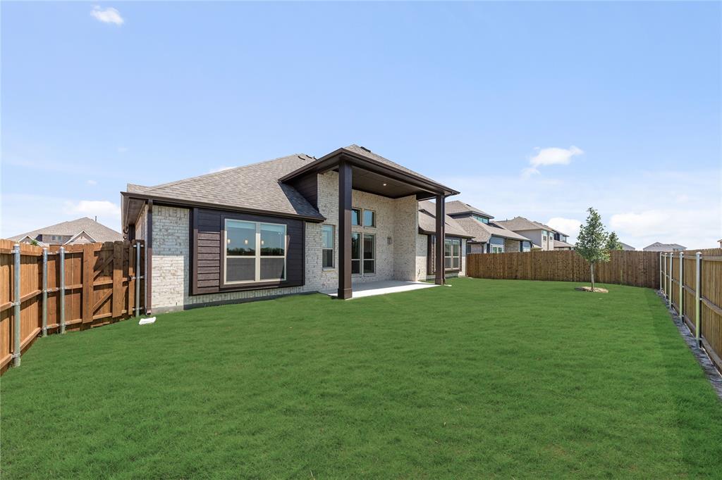 1145 Hitching Post Way Oak Point, TX 75068 - Photo 37 of 39 a front view of a house with a yard