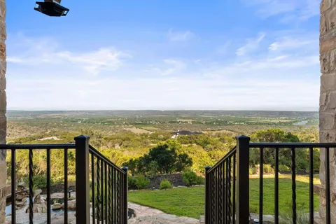 a view of a garden with lawn chairs