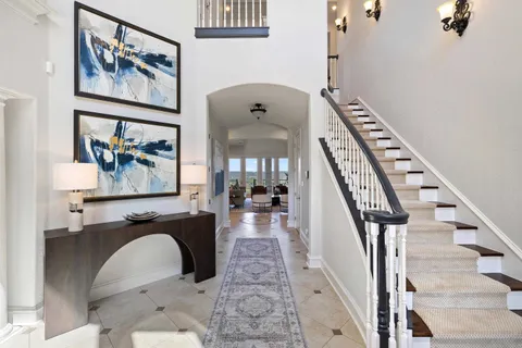 a living room with fireplace furniture and a fireplace