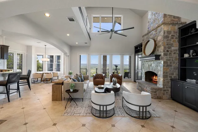 a living room with furniture and a fireplace