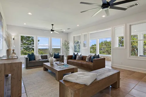 a dining room with furniture and window