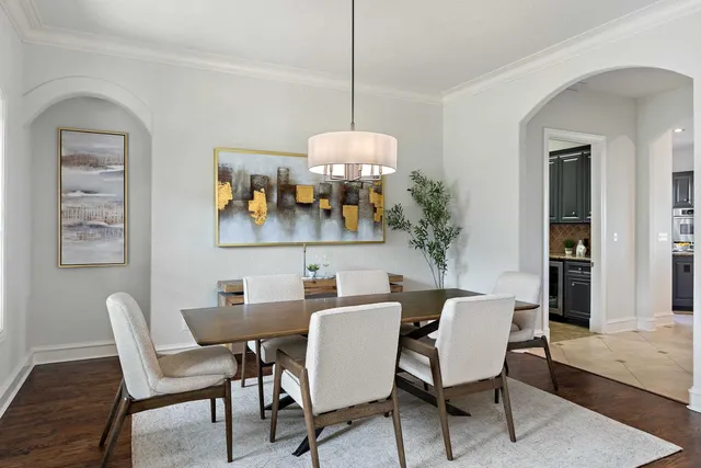 a view of a livingroom with workspace and a window