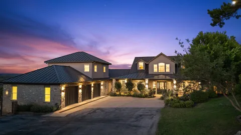 a view of a city with lush green forest