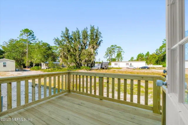 a bathroom with a toilet sink a mirror and shower