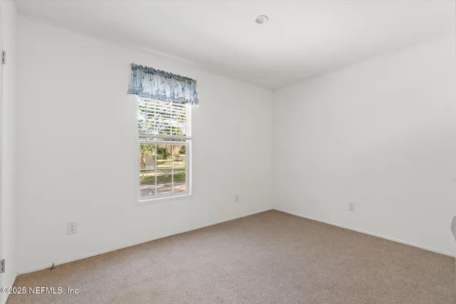 a view of a house with a backyard and balcony
